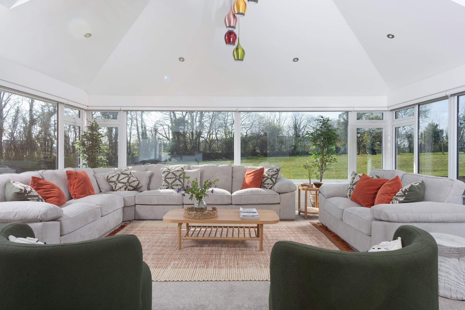 The spacious sitting-room is wonderfully light and airy and really captures the gorgeous setting.