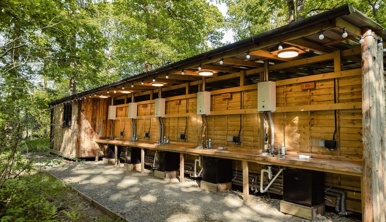 Sun-Dapple has its own kitchen with a sink, running water and fridge in the main cabin.