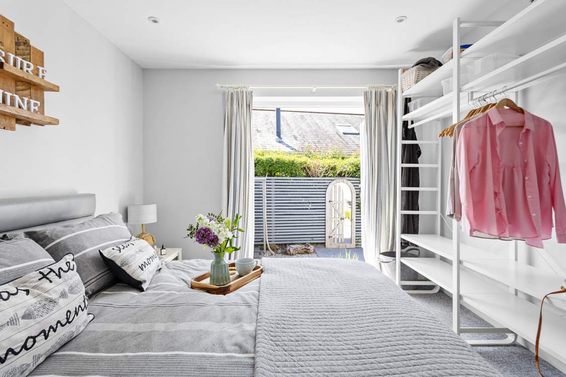 Bedroom 1 offers plenty of storage for your holiday wardrobe as well as direct access to the back garden.