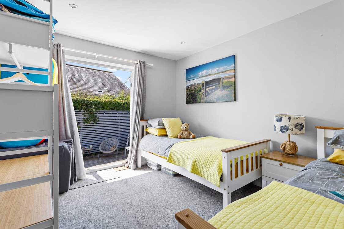 The twin room has access to the back garden.