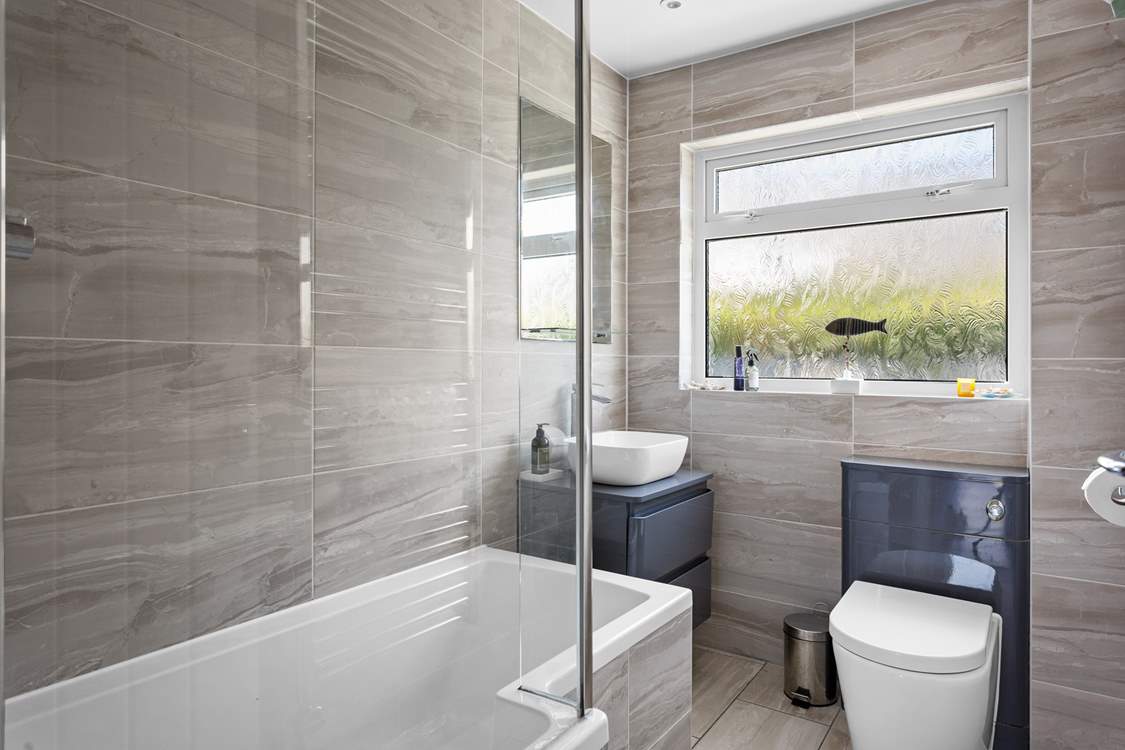 The family bathroom with fitted shower sits between both bedrooms.