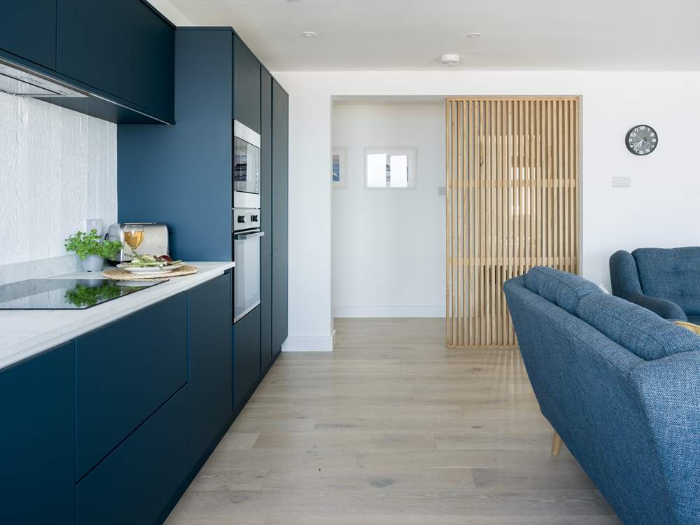 The clever design creates a modern and free flowing apartment.