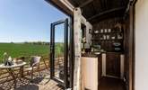 Open the double doors and welcome the outside in.  - Thumbnail Image