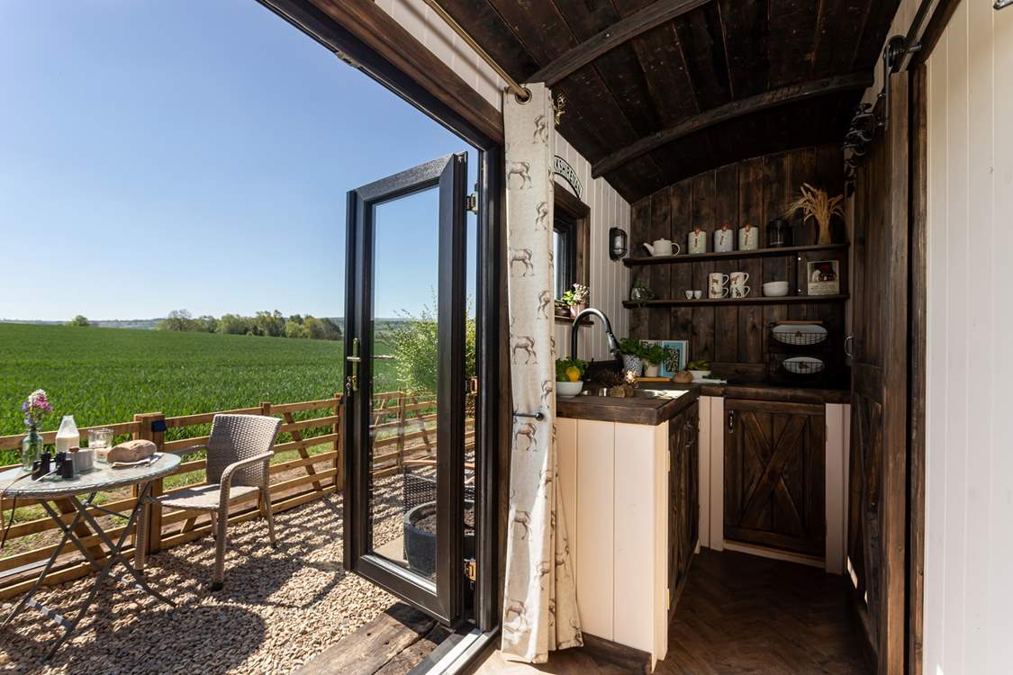 Open the double doors and welcome the outside in.