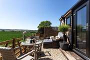 The outside space is a complete suntrap, perfectly designed for romantic getaways.