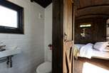 You'll find the en-suite shower room tucked to the right of the kitchen. 