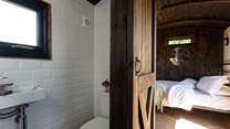You'll find the en-suite shower room tucked to the right of the kitchen. 