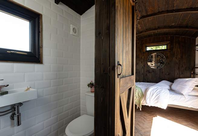 You'll find the en-suite shower room tucked to the right of the kitchen. 