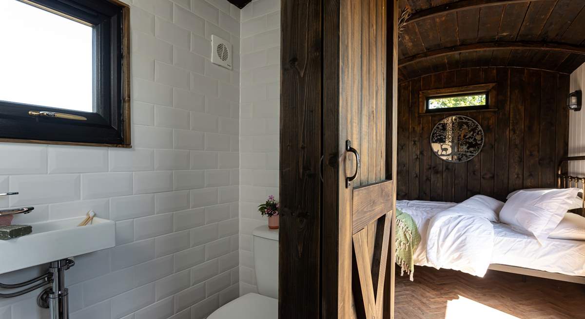 You'll find the en-suite shower room tucked to the right of the kitchen. 