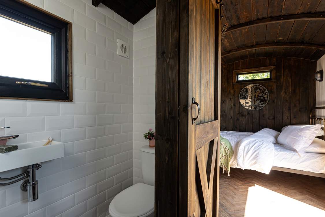 You'll find the en-suite shower room tucked to the right of the kitchen.