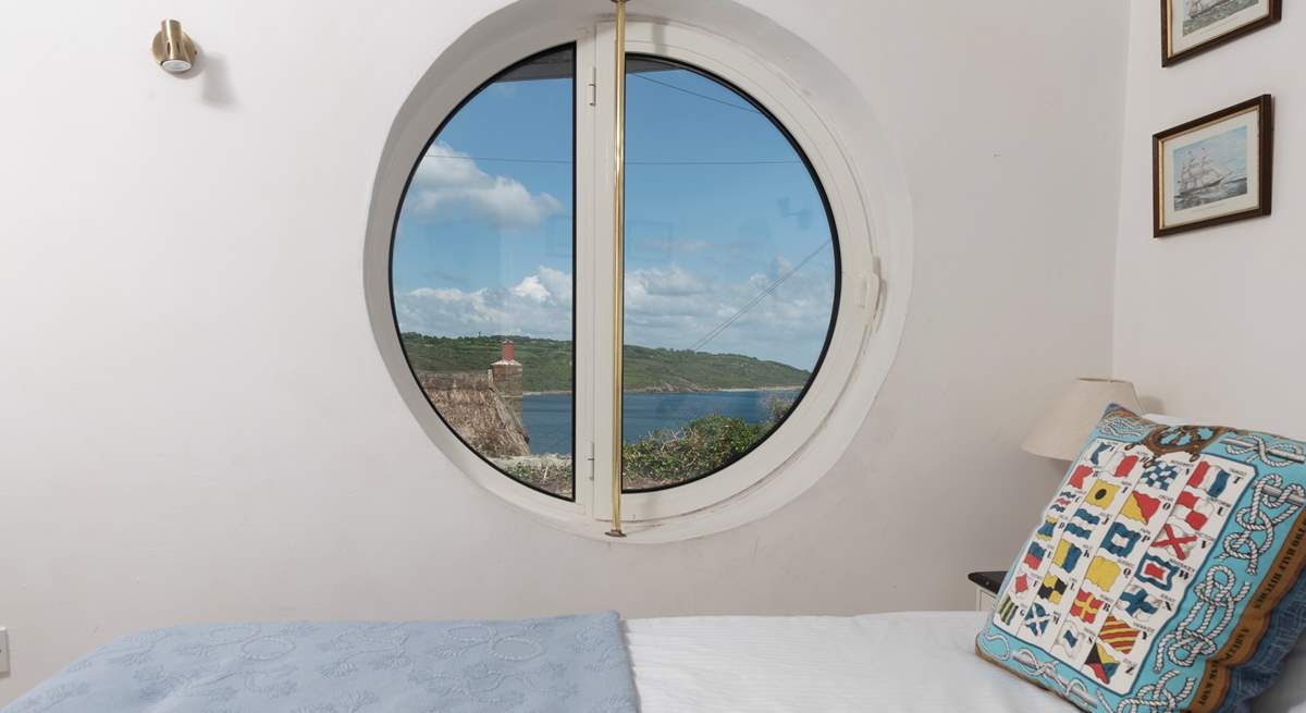 The innovative porthole windows frame the ocean view (coverings for night time are in situ).