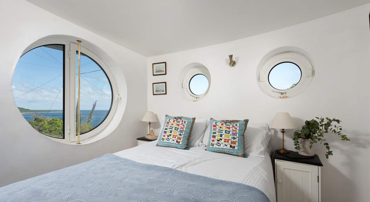 Porthole windows brings the boat shaped architecture together (bespoke coverings for night time are in situ).