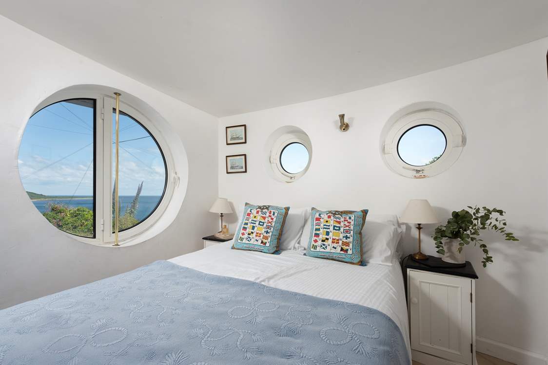 Porthole windows brings the boat shaped architecture together (bespoke coverings for night time are in situ).