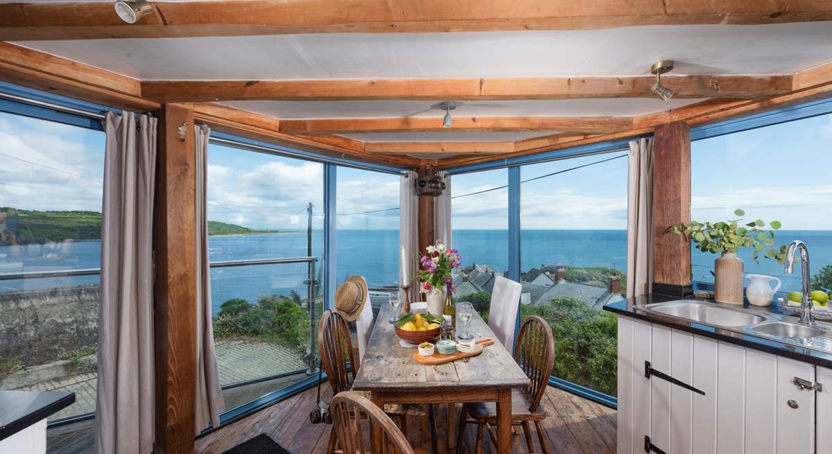 The kitchen/diner boasts panoramic sea views.