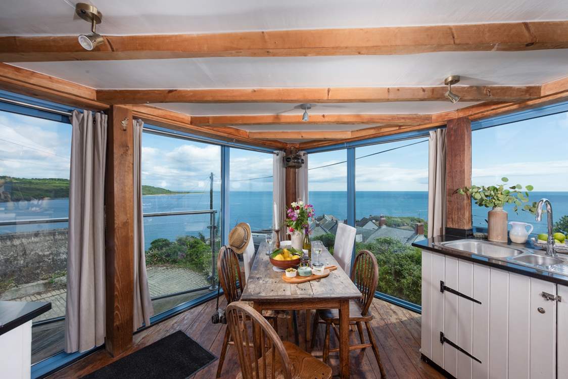 The kitchen/diner boasts panoramic sea views.
