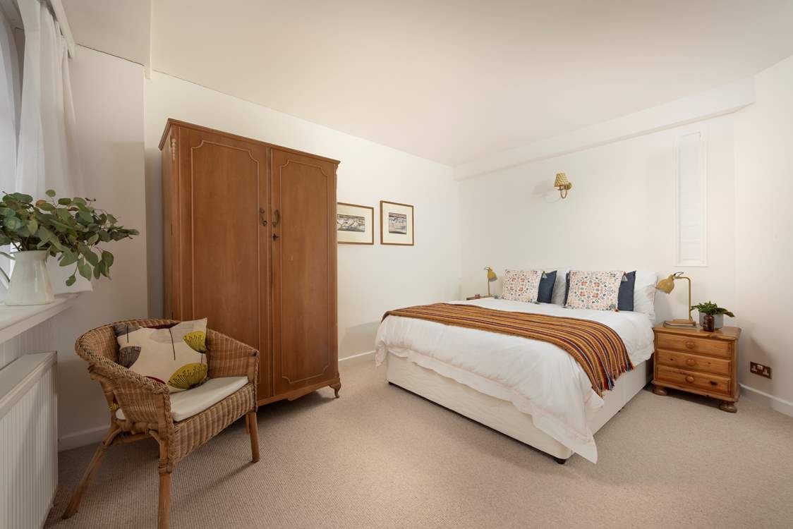 Relax into a restful night's sleep in the king-size bed in bedroom 1.