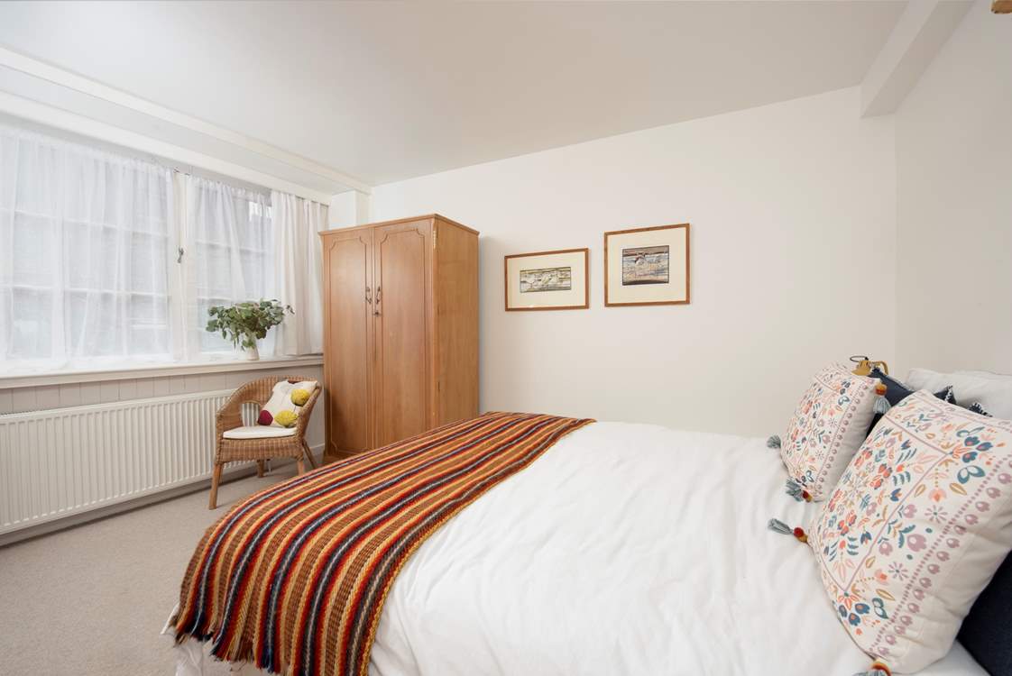 A room full of light from the expanse of windows.