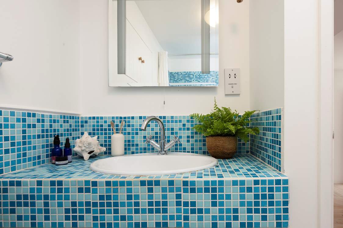 Wash away your sandy day in the spacious bathroom.