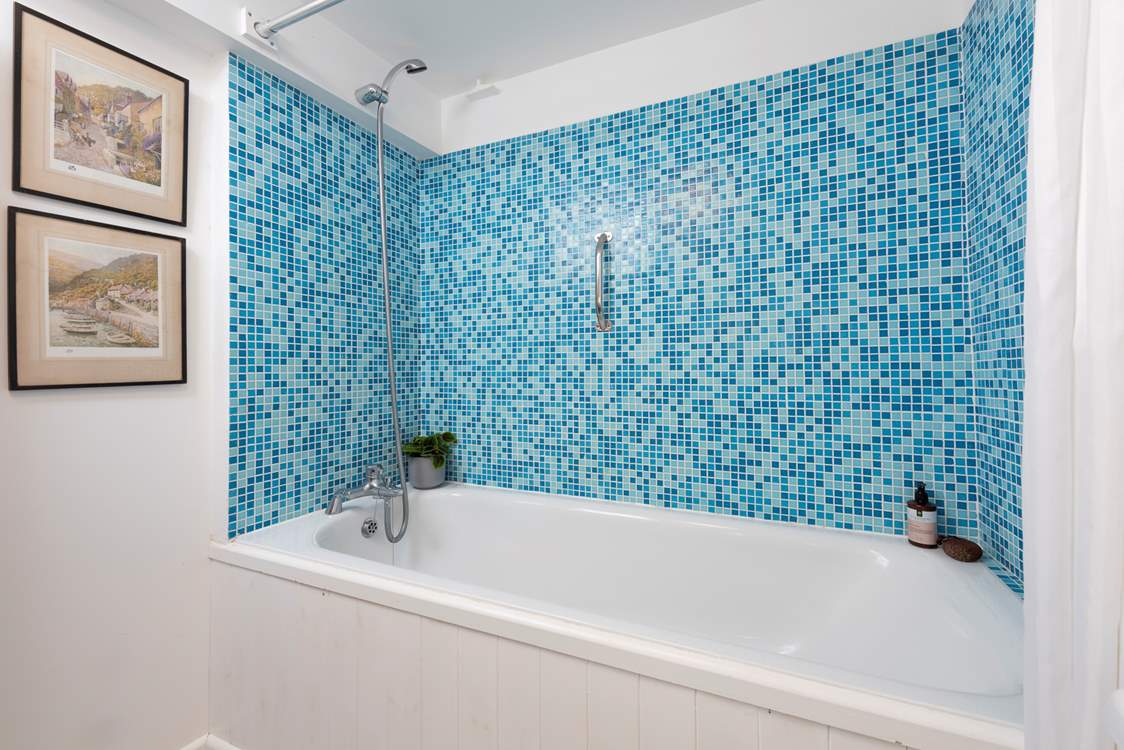 The family bathroom complete with bath and overhead shower.