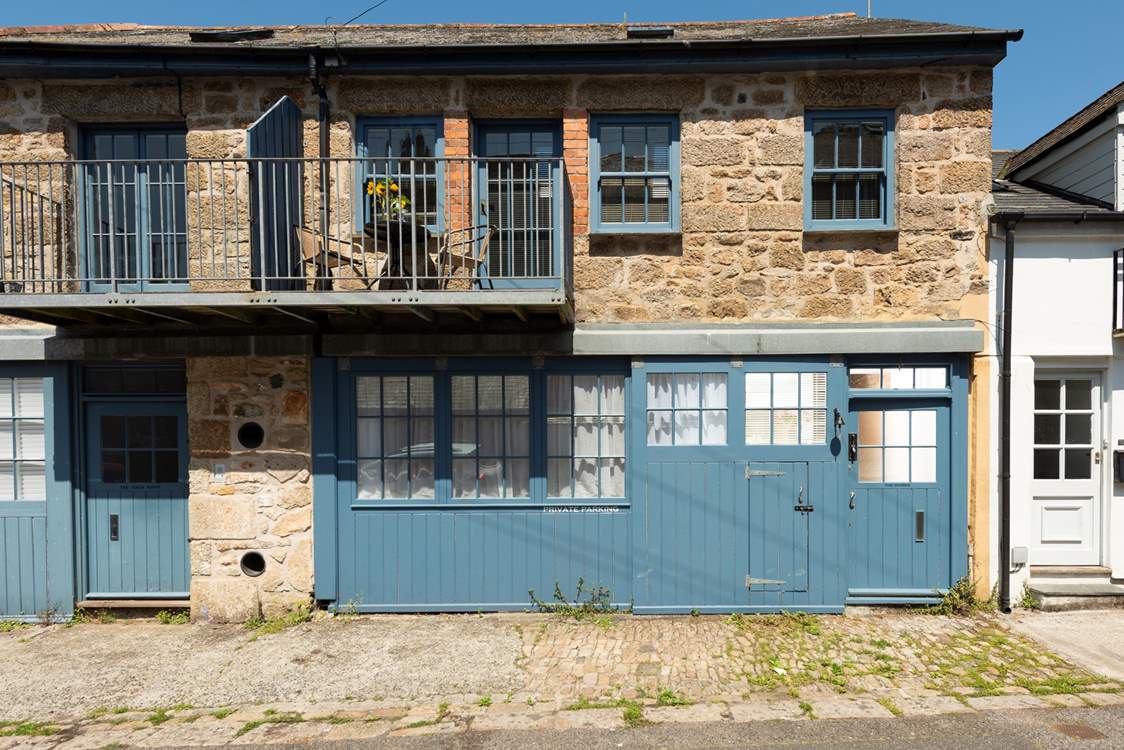 The Works is a terraced converted reverse level coach house with a sweet balcony nestled in the heart of Penzance, with parking directly outside the front door.