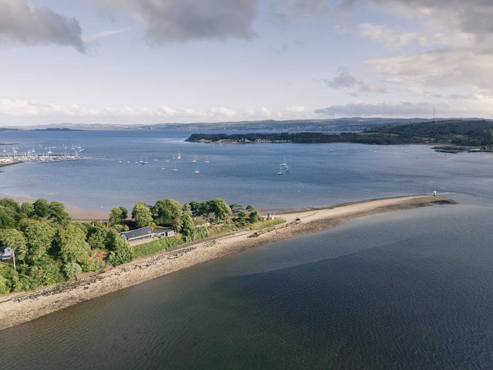 Nestled in a mature garden and moments from the beach is Ferry Point House.