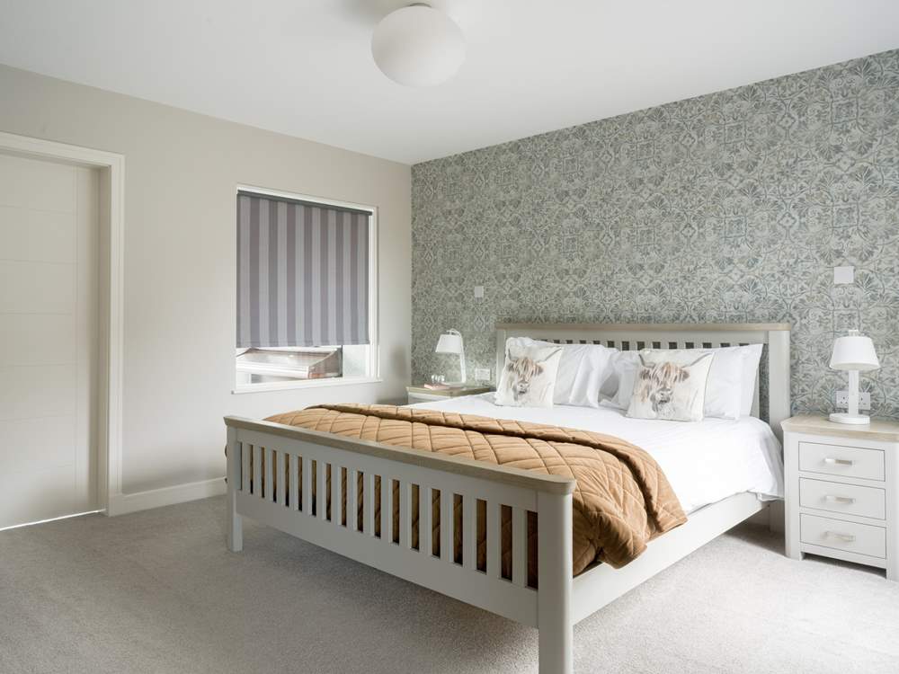 Bedroom 1 is downstairs with views over the garden.