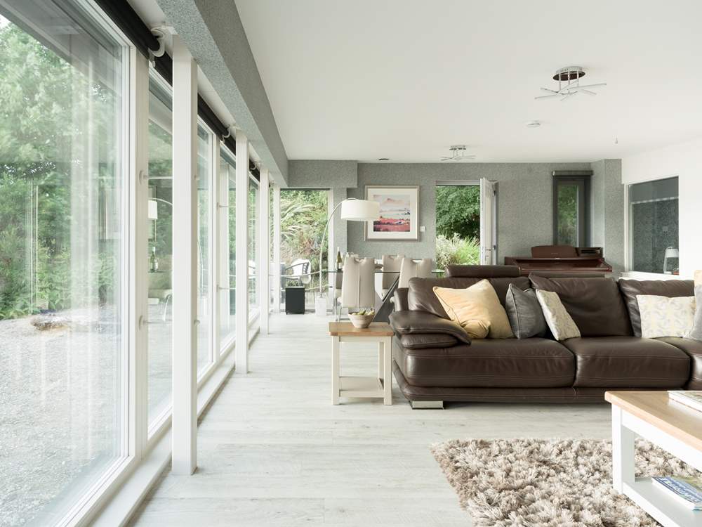 This design-led house is stylish and swathed in light from the enormous full width windows.