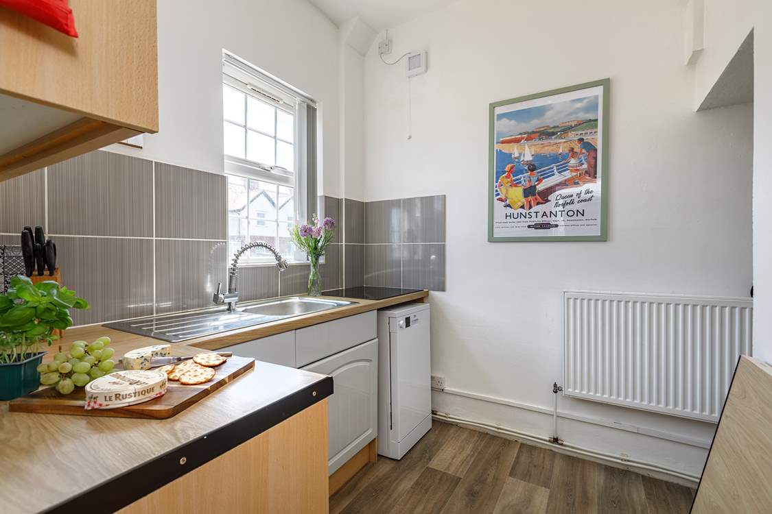 Another kitchen view with a fridge/freezer tucked around the corner.
