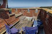 A sheltered rooftop garden, mind the steps.