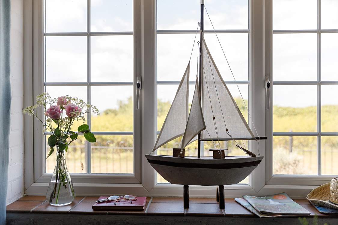 Looking out of the sitting/dining-room with the sea beyond.