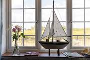 Looking out of the sitting/dining-room with the sea beyond.