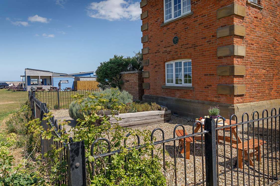 Totally enclosed garden with iron railings.