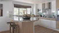 Pull up a pew and enjoy a glass of vino whilst watching the chef work their magic.