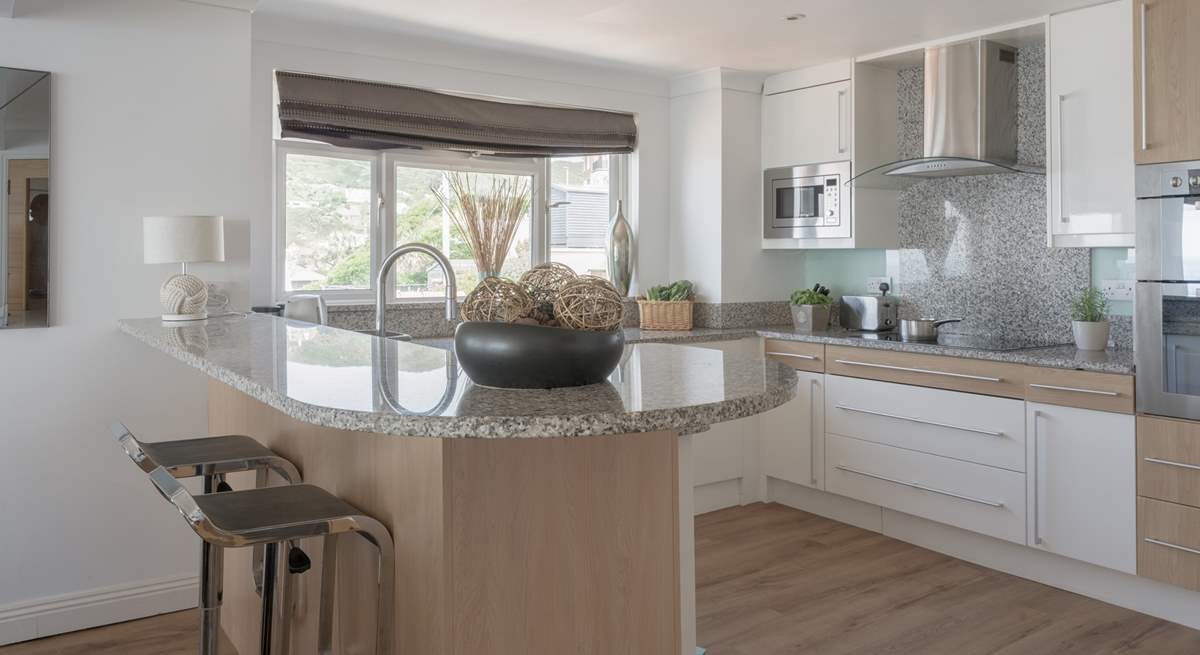 Pull up a pew and enjoy a glass of vino whilst watching the chef work their magic.