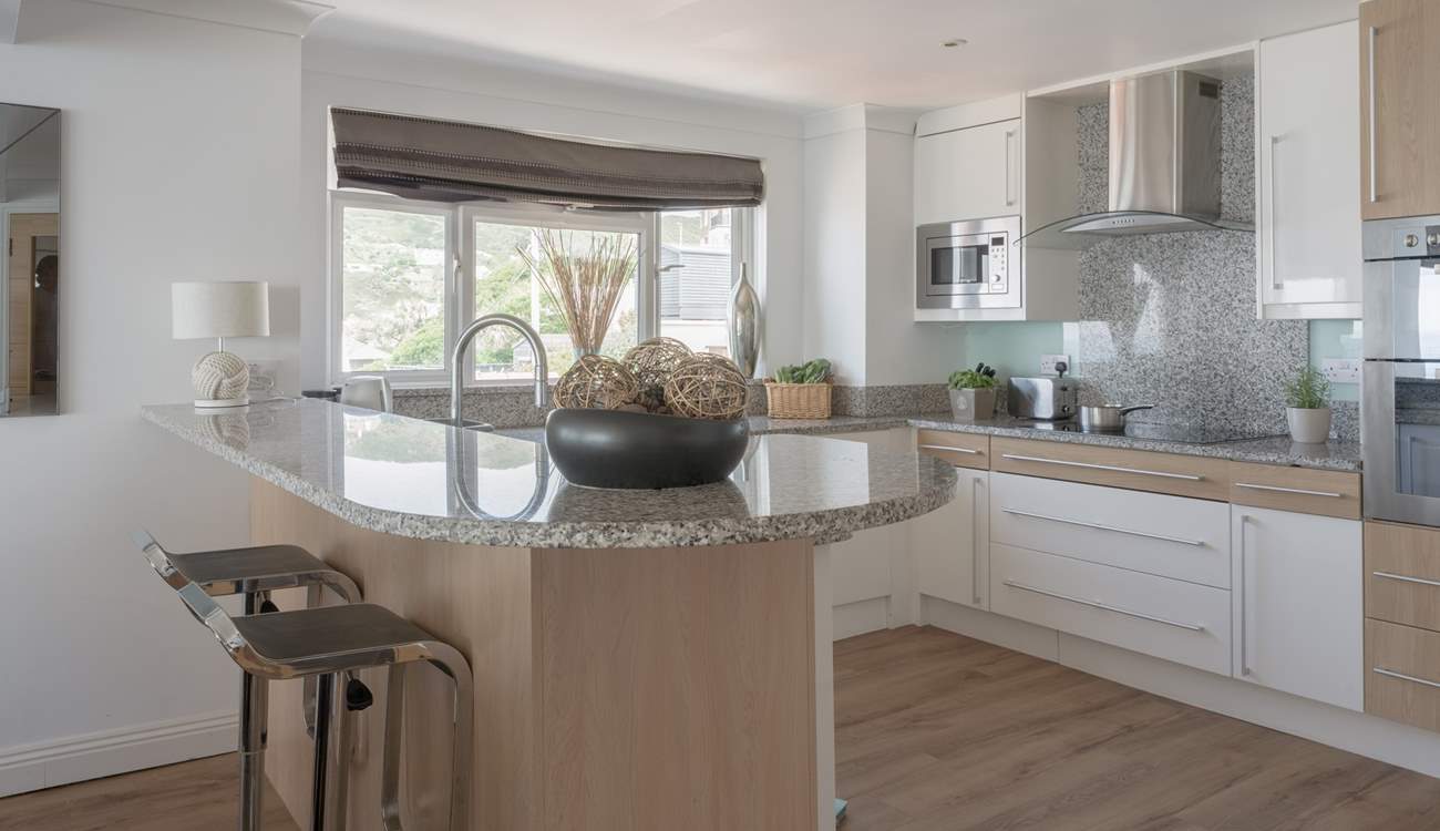 Pull up a pew and enjoy a glass of vino whilst watching the chef work their magic.