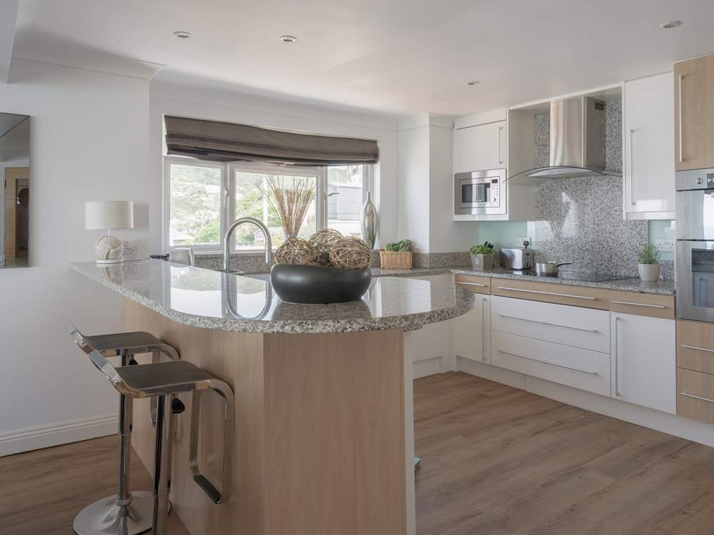 Pull up a pew and enjoy a glass of vino whilst watching the chef work their magic.