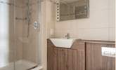 The family bathroom sits opposite the twin room offering a shower cubicle and bath. - Thumbnail Image