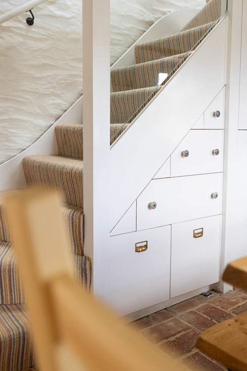 Please take care at the bottom of the stairs.