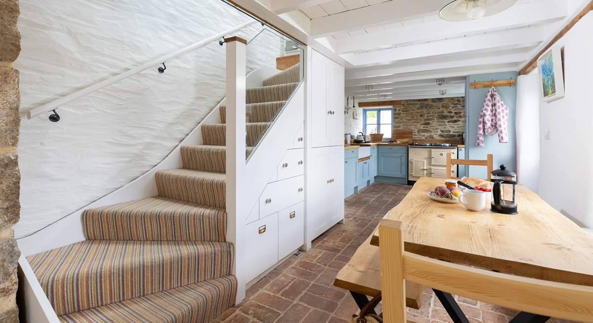 The stairs lead to the bedrooms and family shower-room. 