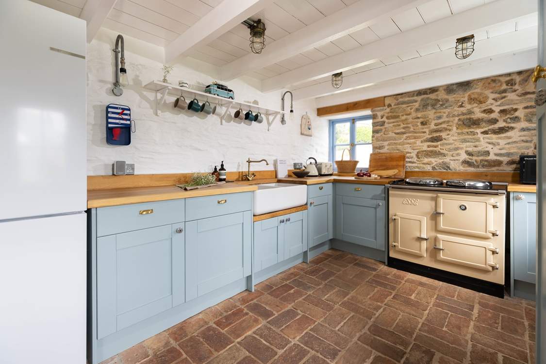 The cottage kitchen has an electric Esse for all your cooking needs.