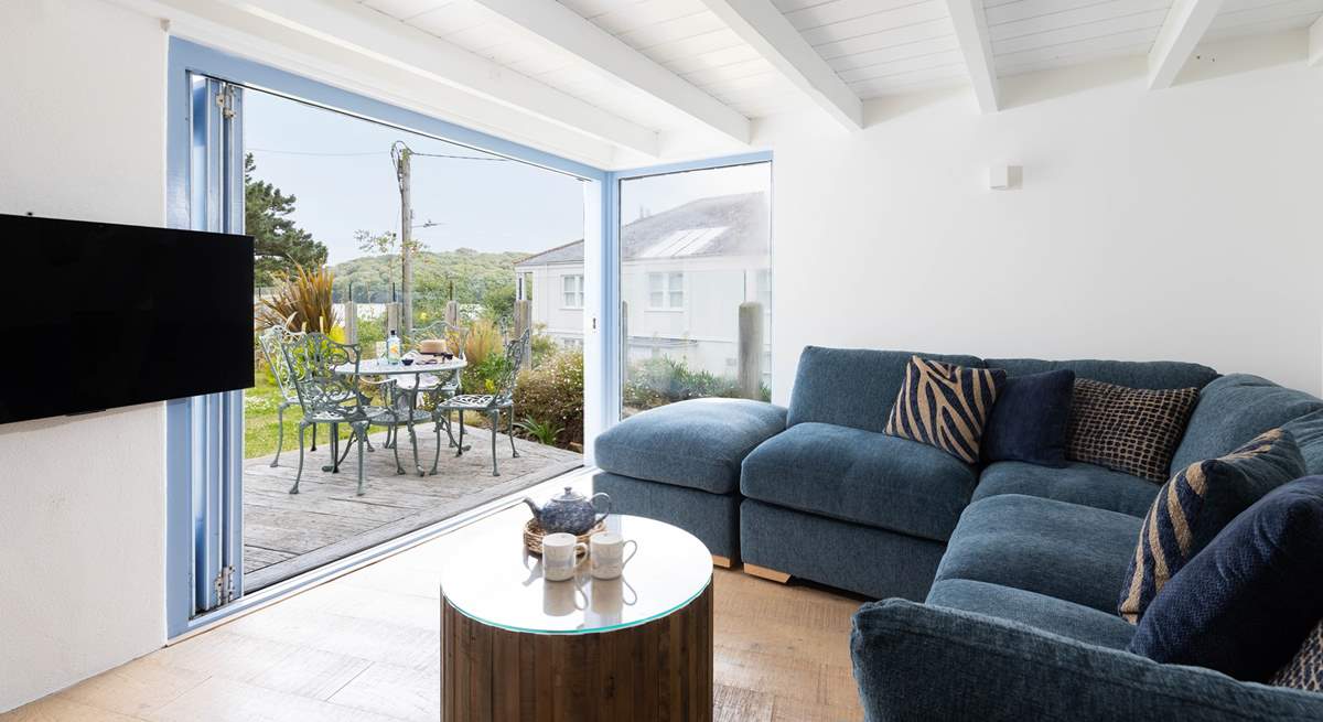 The sitting-area doors open up to the decking. 