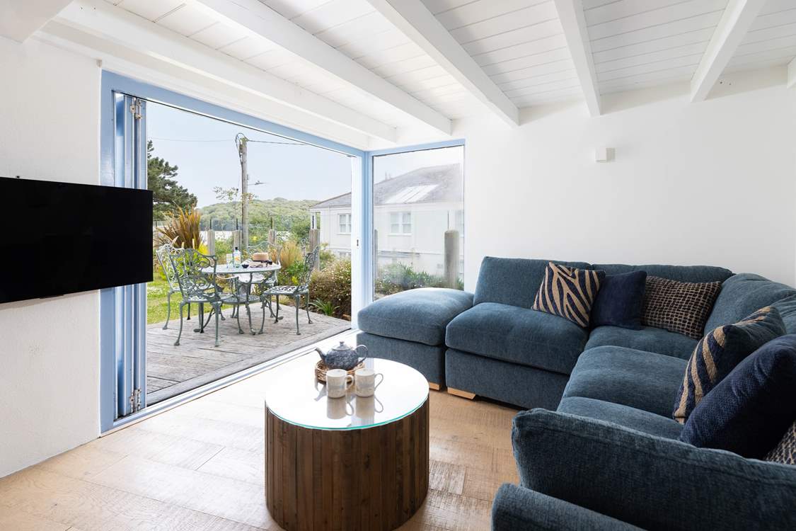 The sitting-area doors open up to the decking.