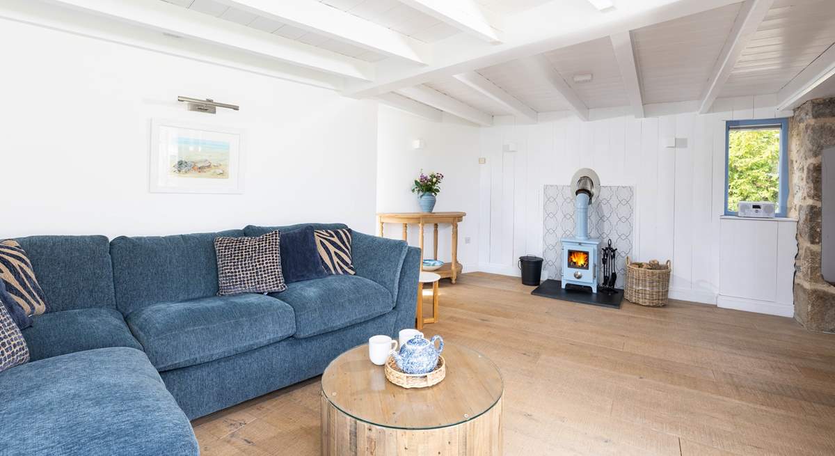 The sitting room is ever so cosy with the wood burner lit. 