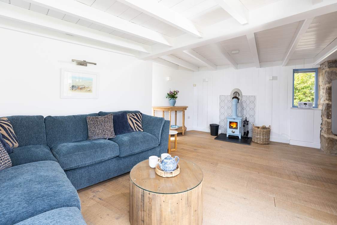 The sitting room is ever so cosy with the wood burner lit.