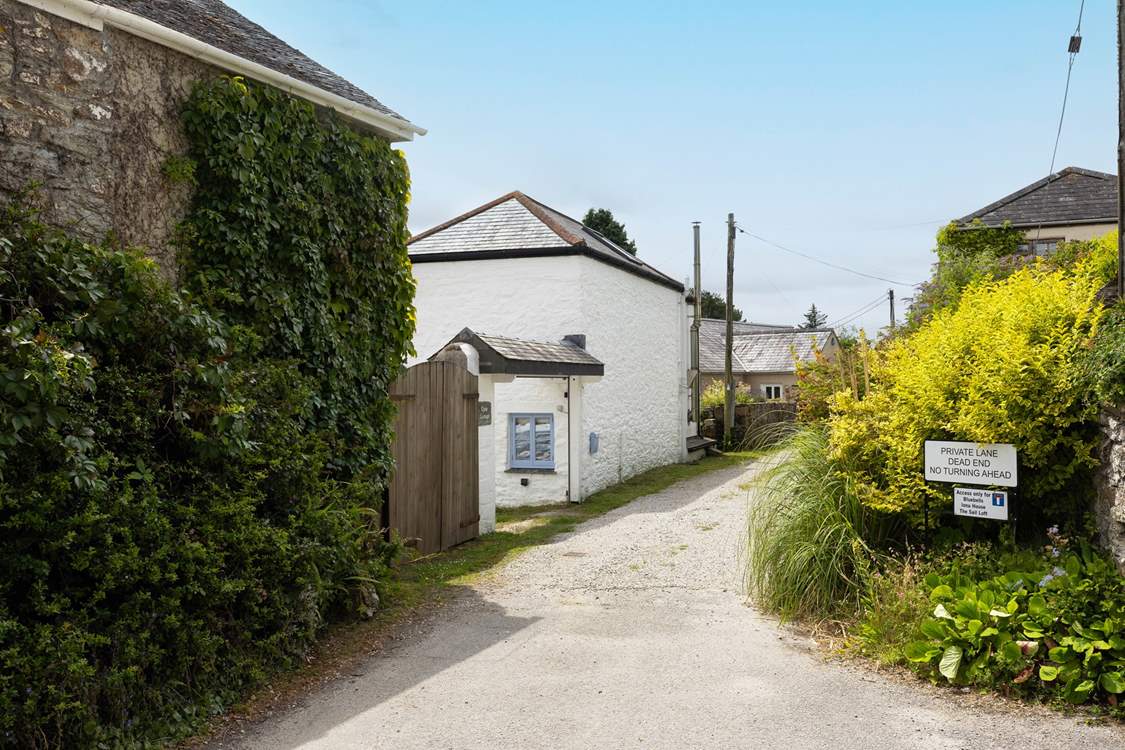 Quay Cottage is at the start of a private lane.