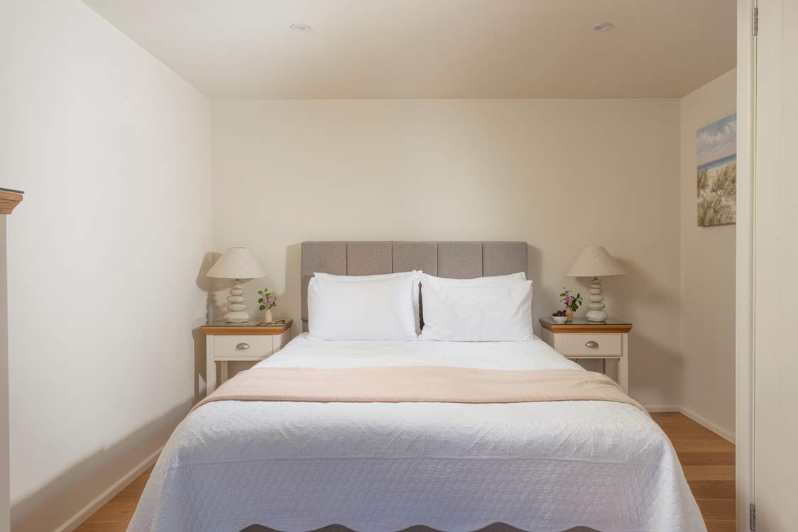 A king-size bed awaits in bedroom 1.