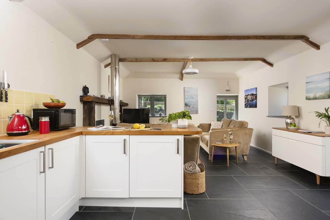 Step inside and the open plan living-room is set to welcome you.