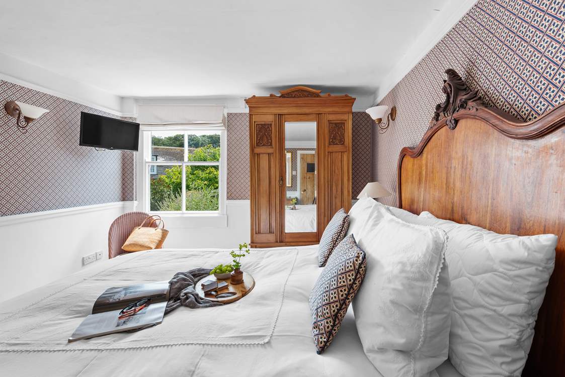 Period furniture perfectly complements the house.