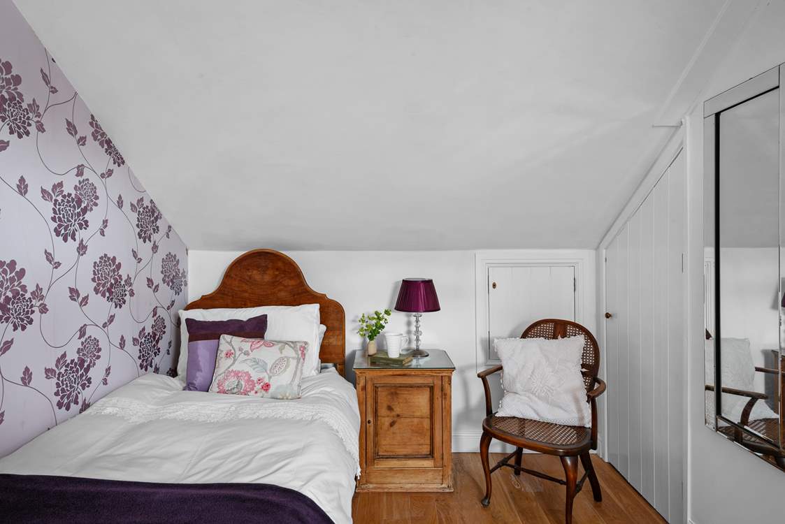 Set under the eaves which adds a sense of charm and romance.