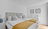 Twin beds await in the second bedroom. - Thumbnail Image